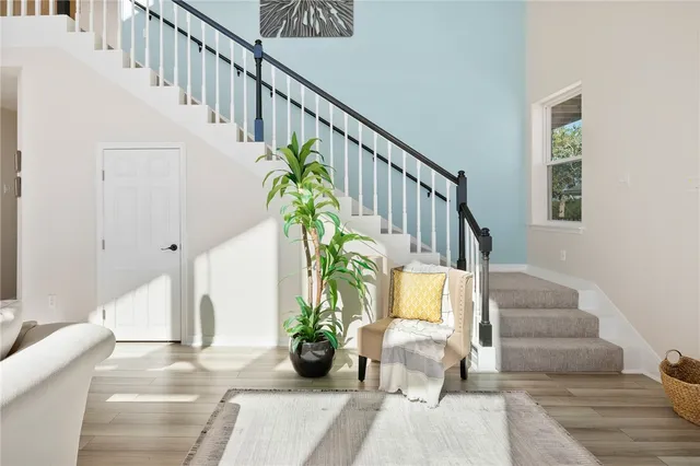 a bedroom with a bed and a wall painting