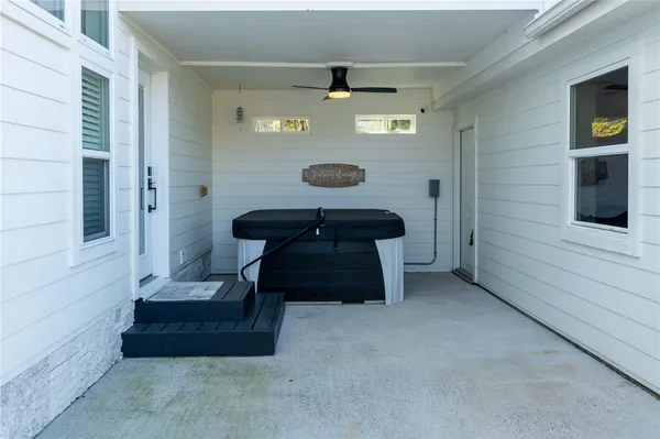 a view of a house with a yard and porch