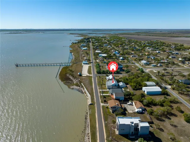 an aerial view of a house with outdoor space
