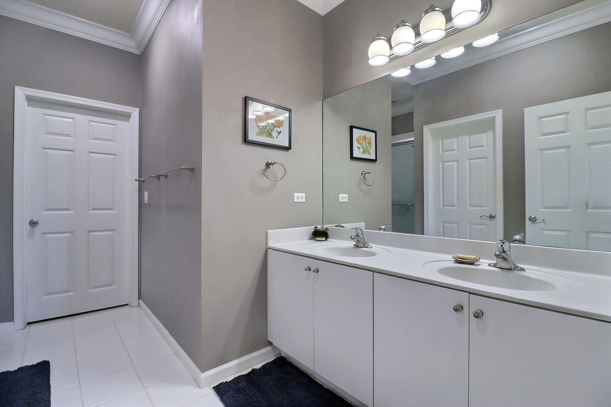 216 Quarry Knoll Way Jupiter, FL 33458 - Photo 19 of 23 a bathroom with a double vanity sink and a mirror