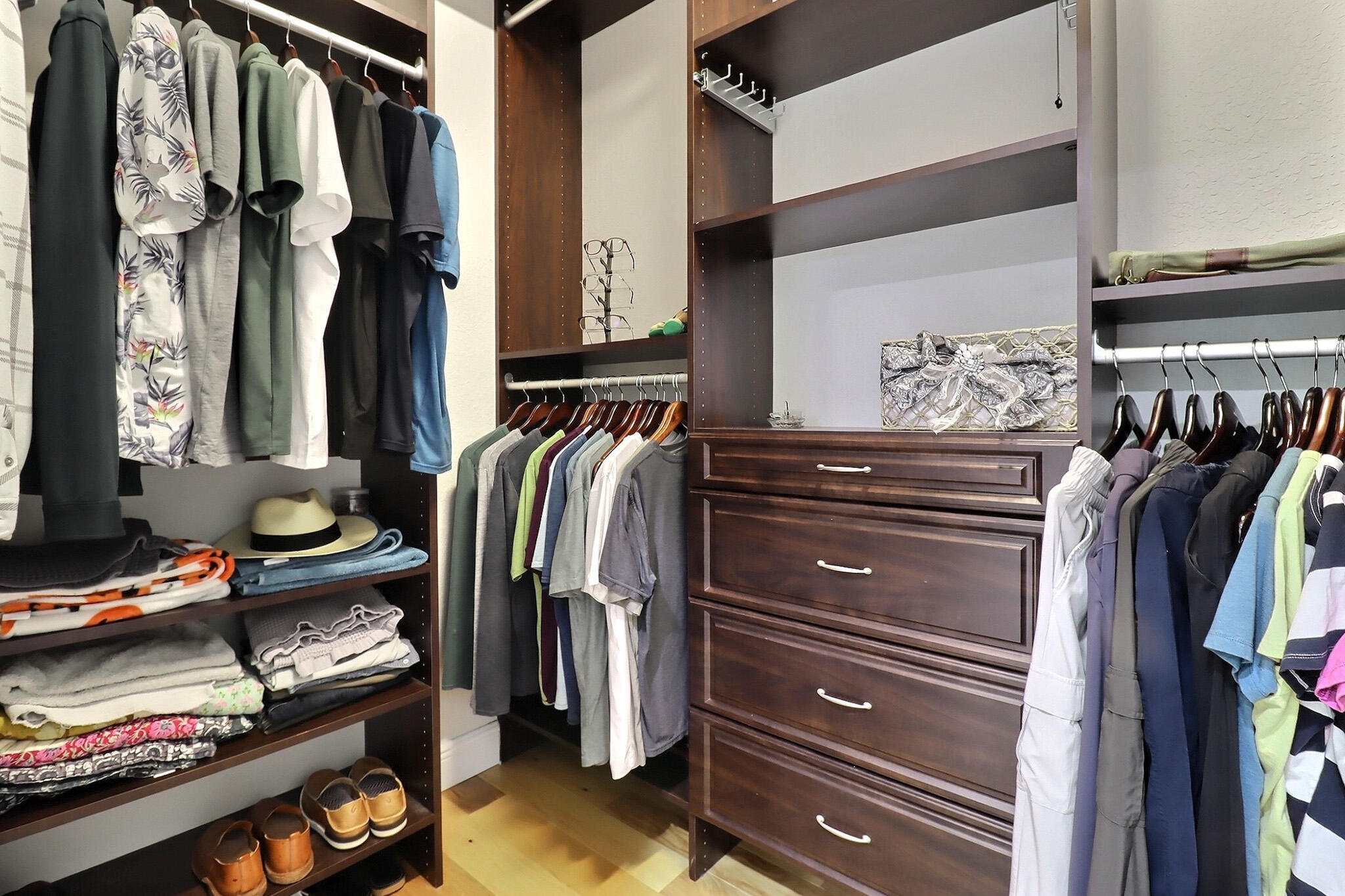 216 Quarry Knoll Way Jupiter, FL 33458 - Photo 20 of 23 a view of walk in closet with clothes and shoes