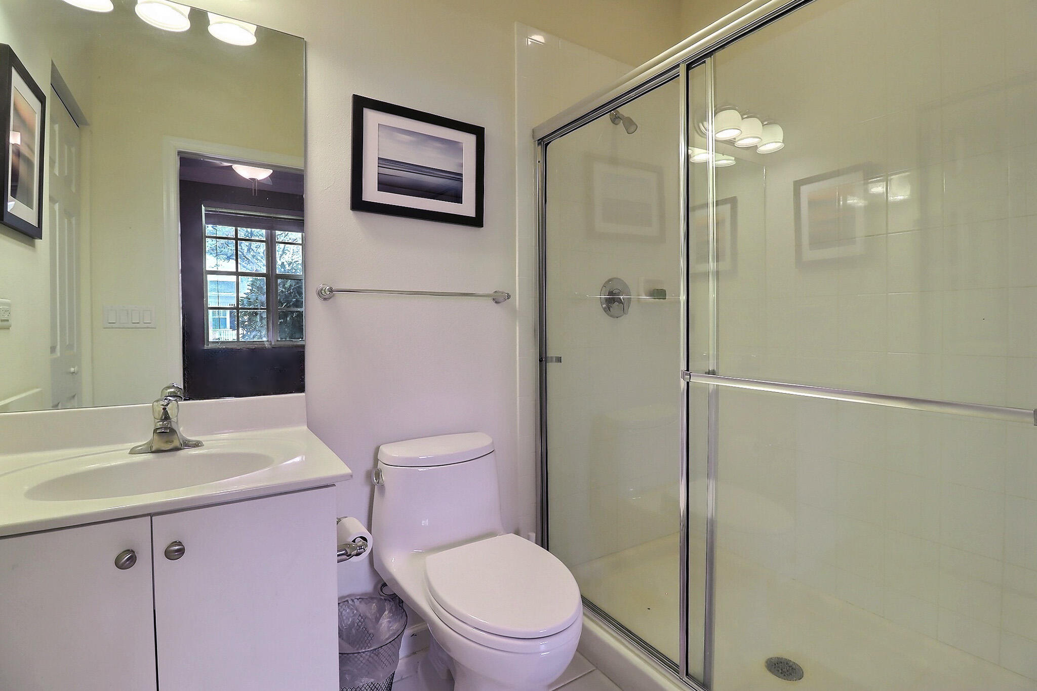 216 Quarry Knoll Way Jupiter, FL 33458 - Photo 3 of 23 a bathroom with a toilet a sink and mirror