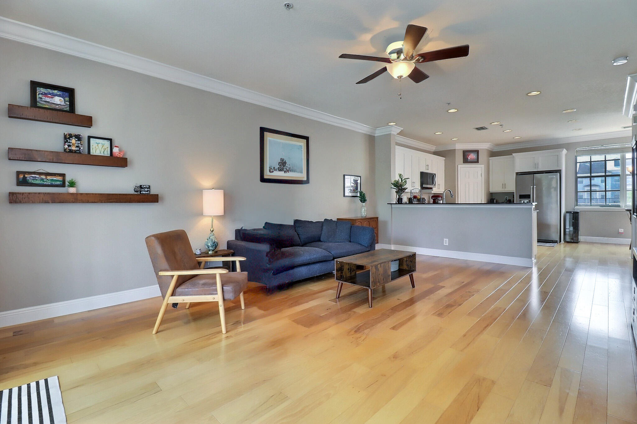 216 Quarry Knoll Way Jupiter, FL 33458 - Photo 10 of 23 a living room with furniture and a wooden floor