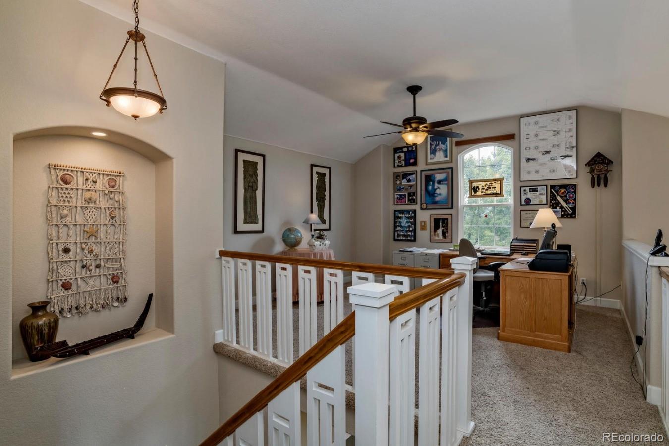 8974 Old Tom Morris Circle Highlands Ranch, CO 80129 - Photo 19 of 28 a view of a livingroom with furniture and windows