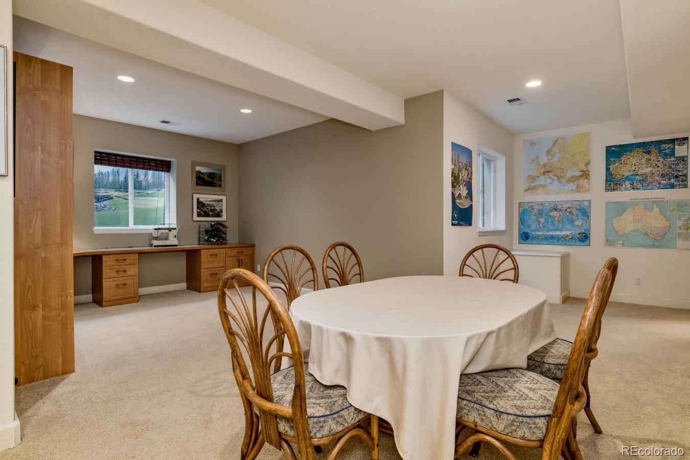 8974 Old Tom Morris Circle Highlands Ranch, CO 80129 - Photo 25 of 28 a view of a dining room with furniture window and wooden floor