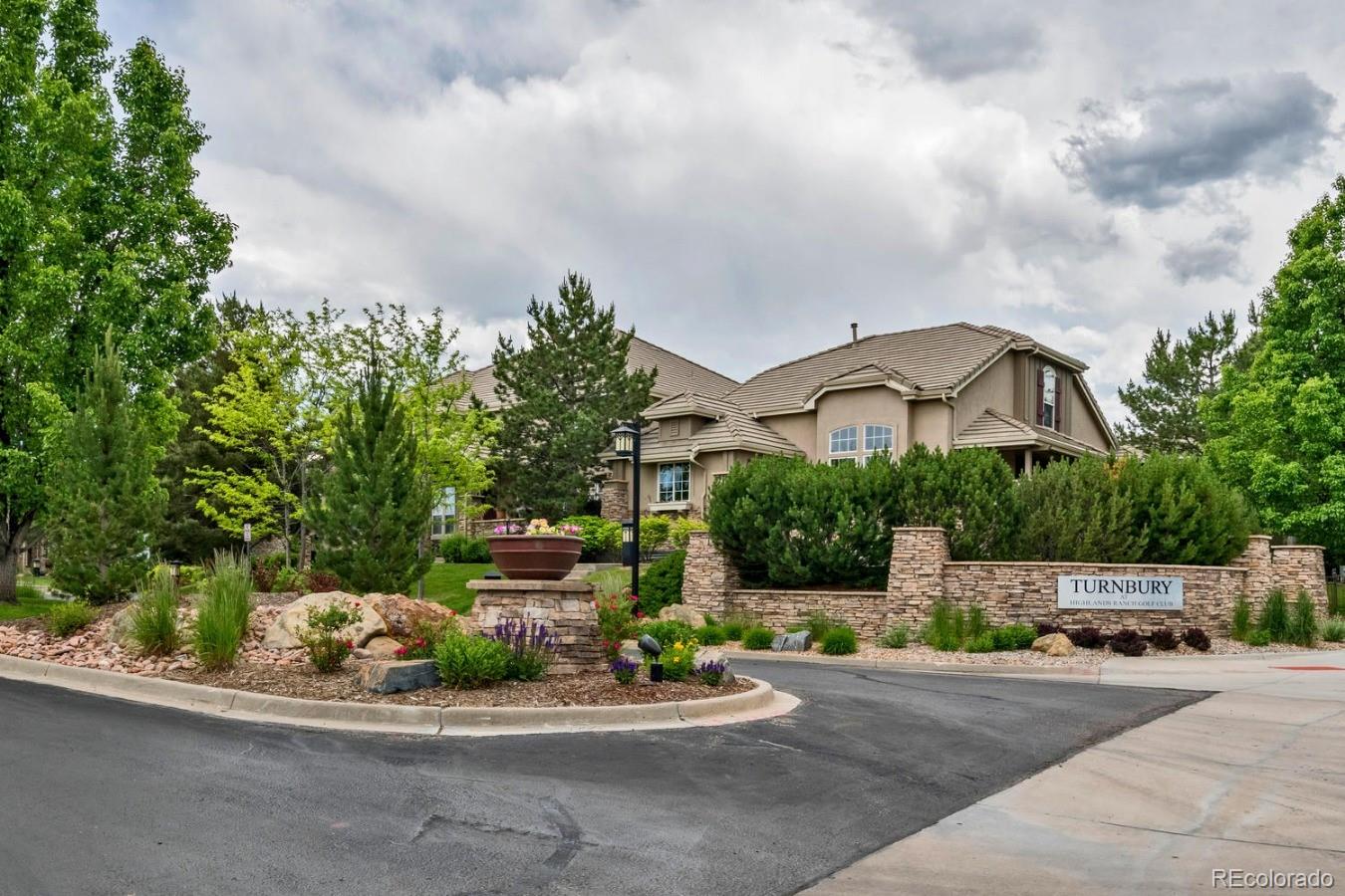 8974 Old Tom Morris Circle Highlands Ranch, CO 80129 - Photo 28 of 28 a couple of cars parked in front of a house
