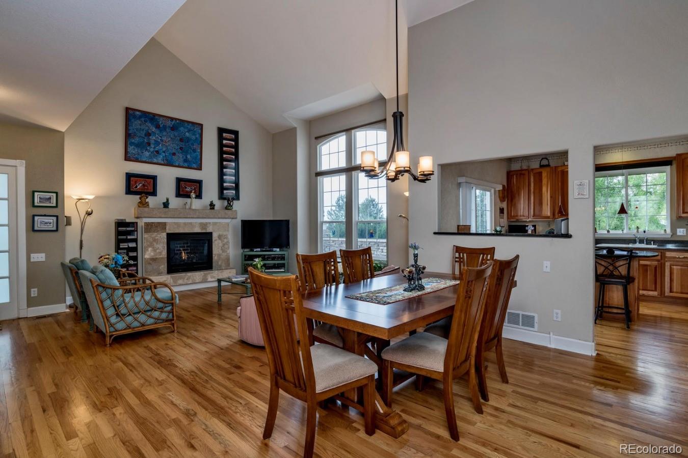 8974 Old Tom Morris Circle Highlands Ranch, CO 80129 - Photo 7 of 28 a view of a dining room with furniture window and wooden floor
