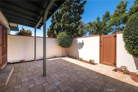 a backyard of a house with a tree