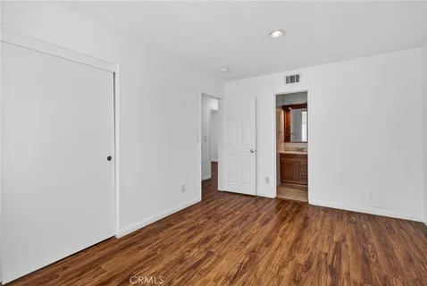 a view of hallway with wooden floor