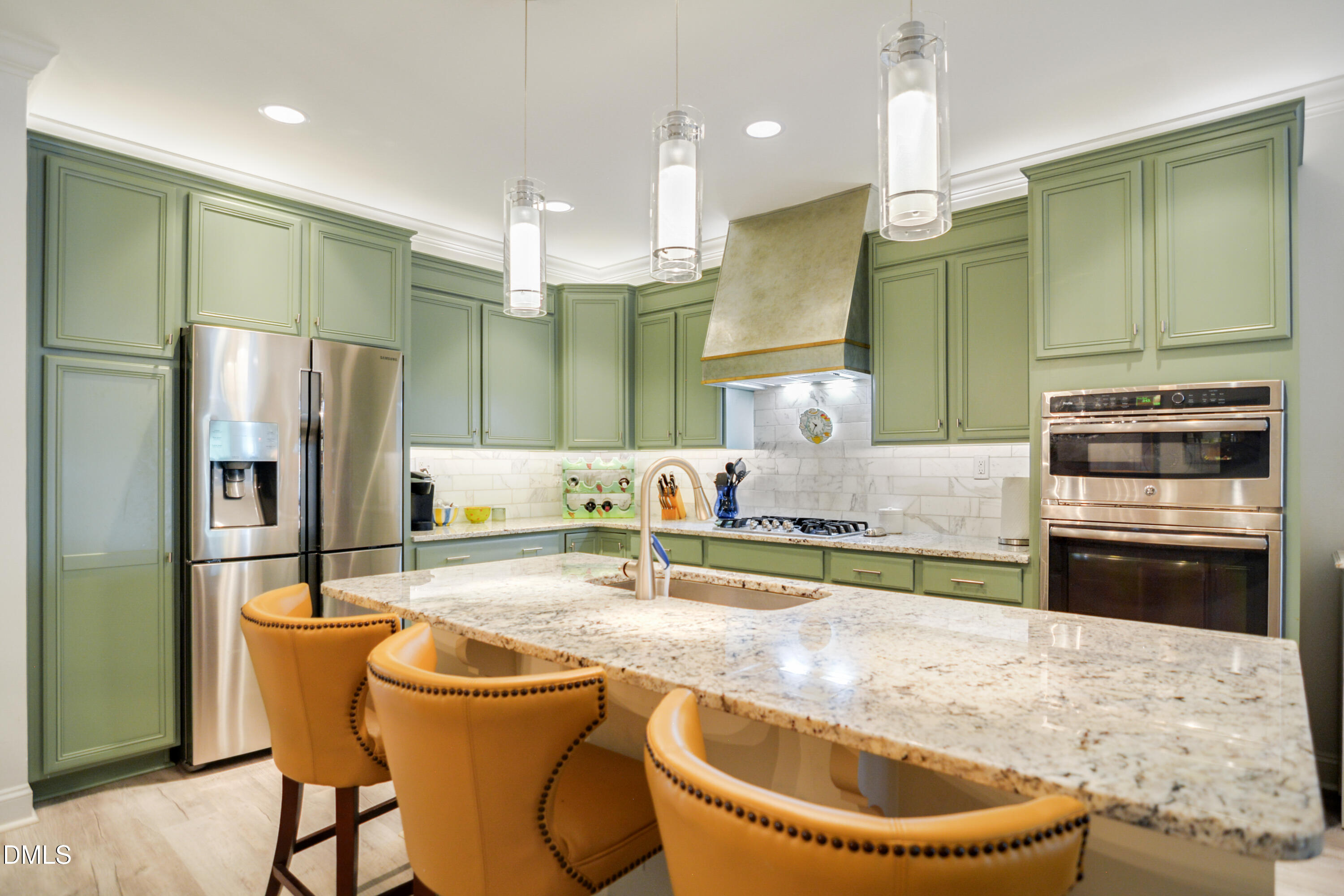 2408 Noble Road Raleigh, NC 27608 - Photo 11 of 25 a kitchen with stainless steel appliances granite countertop a sink a stove and a refrigerator