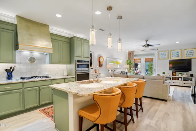 a view of a dining room with furniture and a flat screen tv