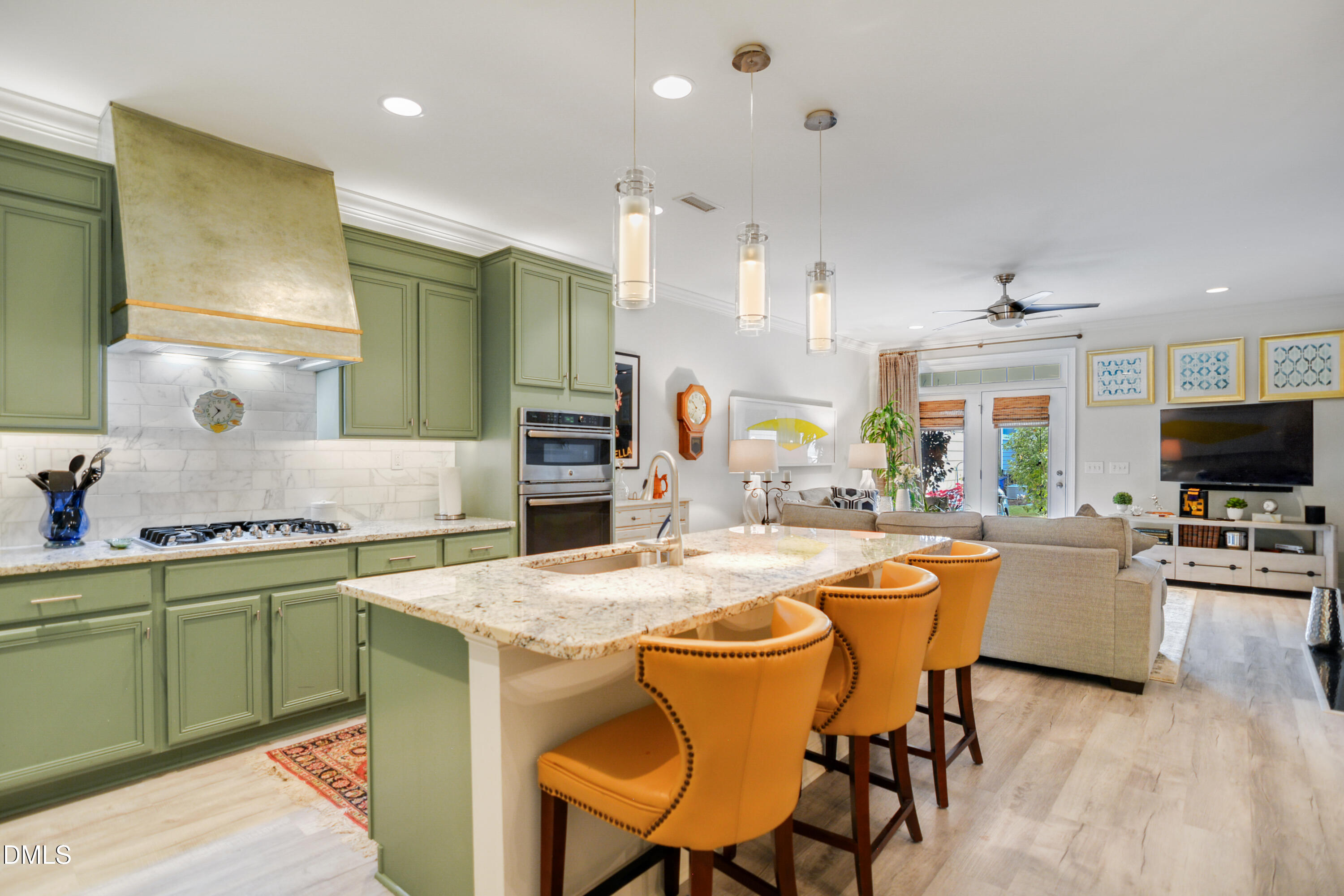 2408 Noble Road Raleigh, NC 27608 - Photo 12 of 25 a view of a dining room with furniture and a flat screen tv