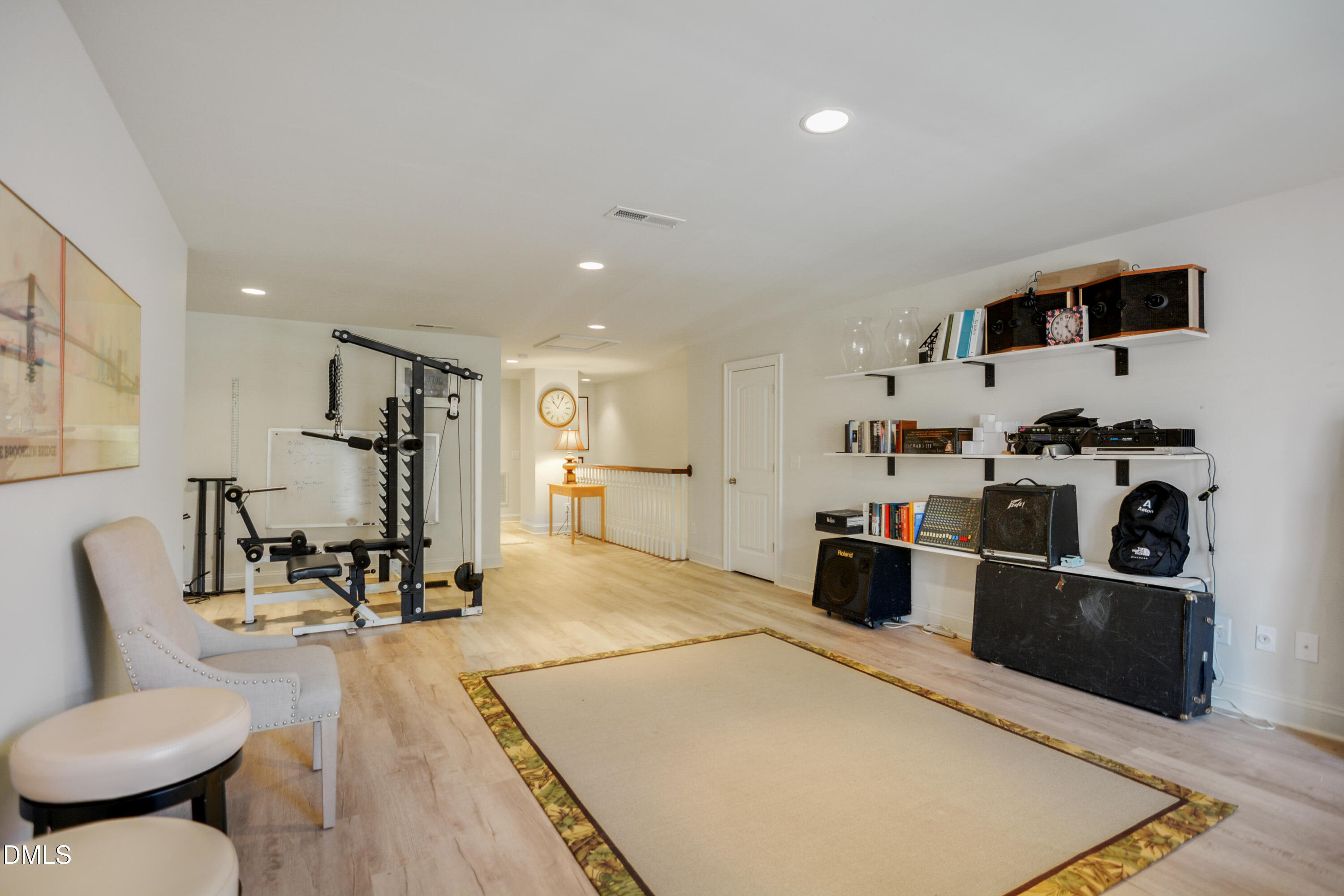 2408 Noble Road Raleigh, NC 27608 - Photo 23 of 25 a living room with furniture a wooden floor and a sink