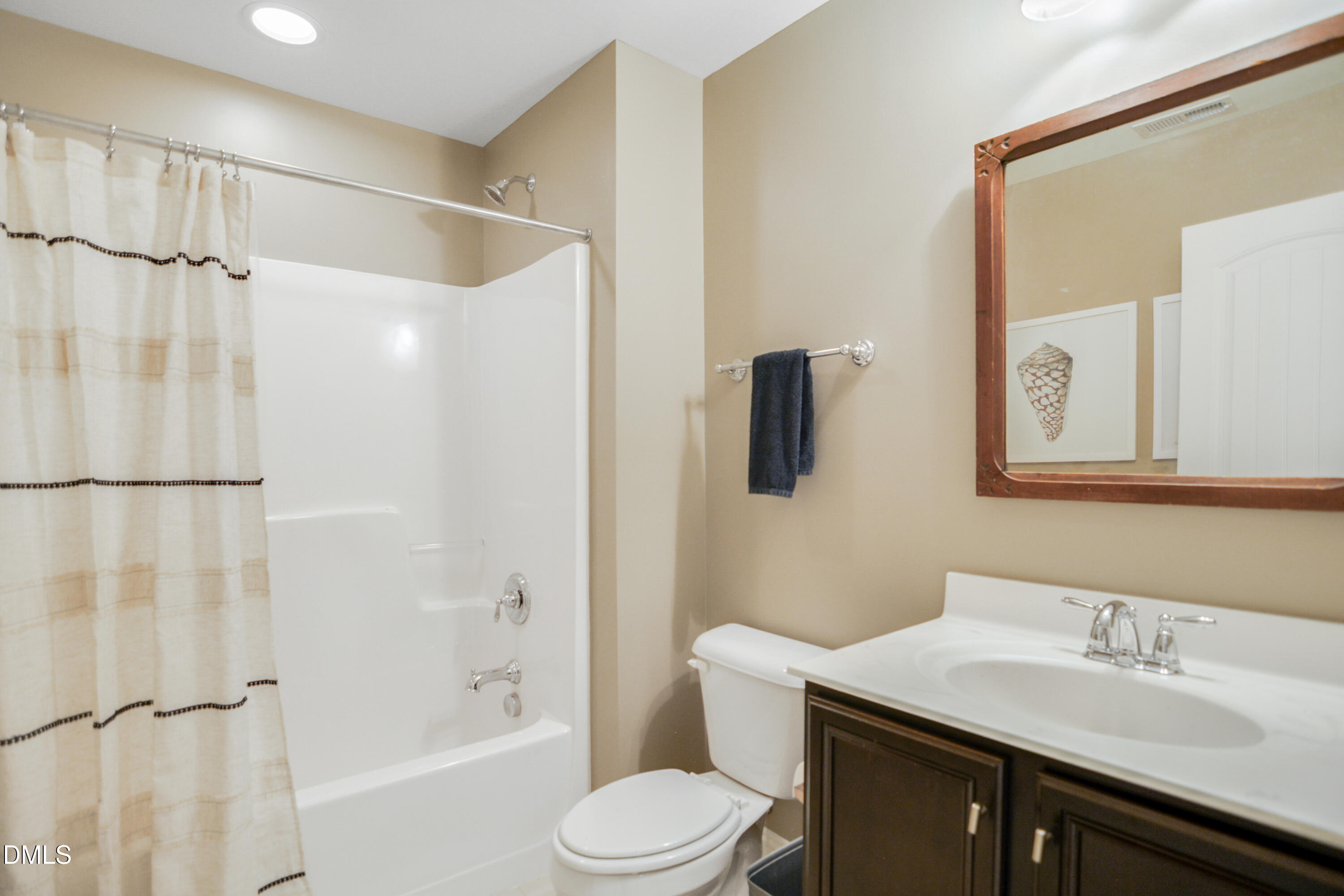2408 Noble Road Raleigh, NC 27608 - Photo 24 of 25 a bathroom with a sink toilet vanity and shower