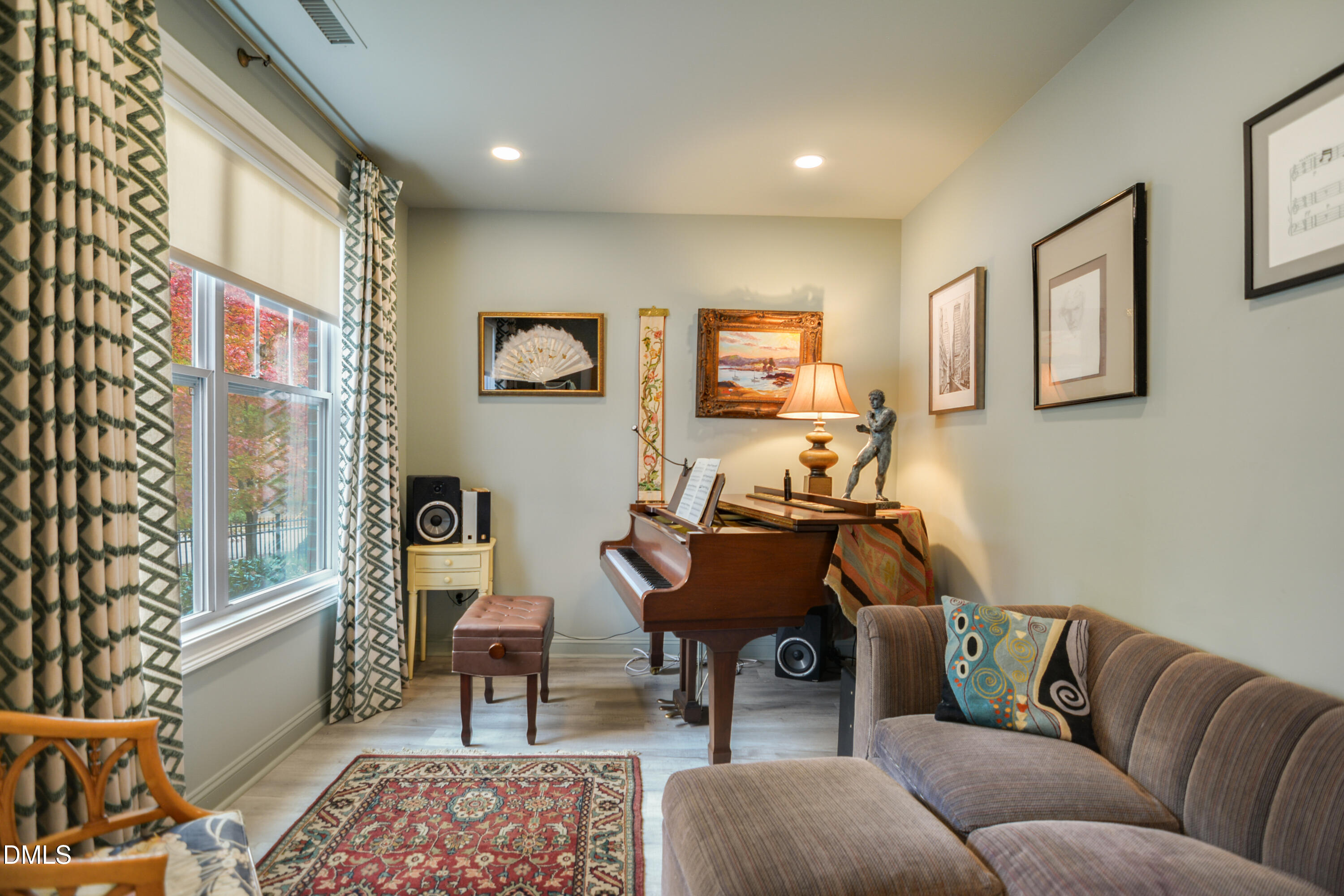 2408 Noble Road Raleigh, NC 27608 - Photo 4 of 25 a living room with furniture a rug and a window