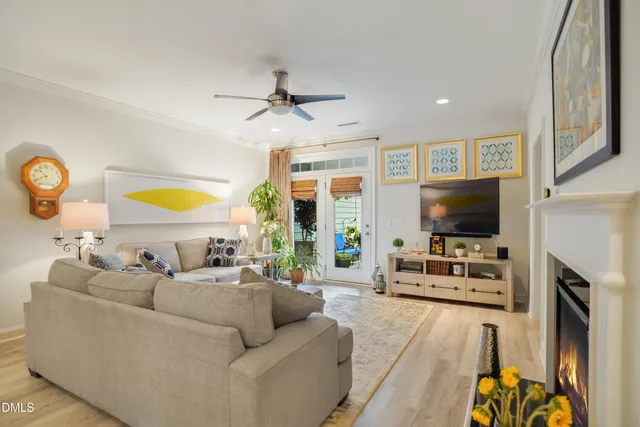 a living room with fireplace furniture and a flat screen tv
