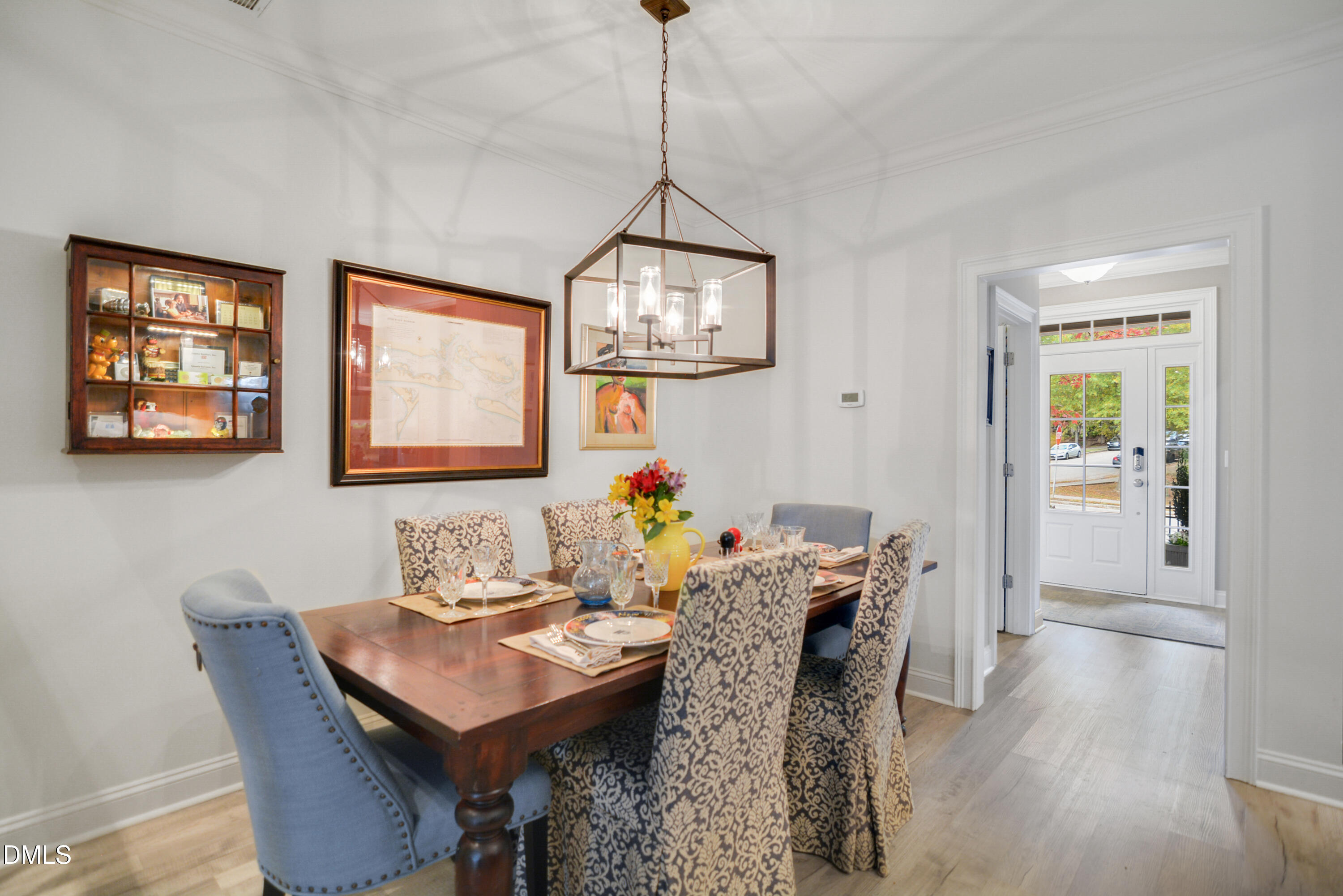 2408 Noble Road Raleigh, NC 27608 - Photo 10 of 25 a view of a dining room with furniture and wooden floor