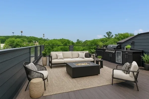 a roof deck with couches and potted plants with wooden floor and city view