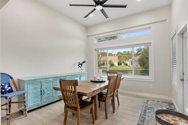 a view of a dining room with furniture window and outside view
