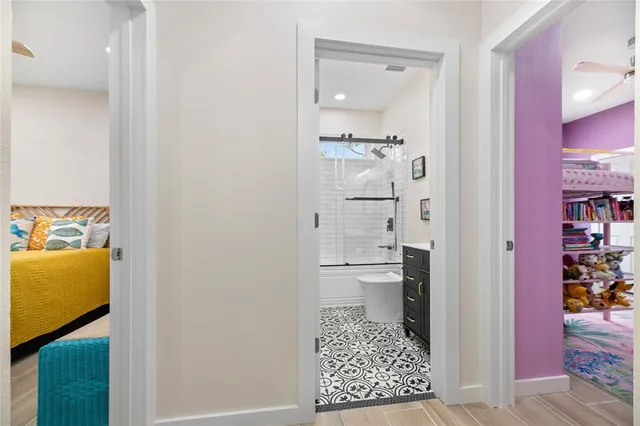 a bedroom with a bed and a table in it