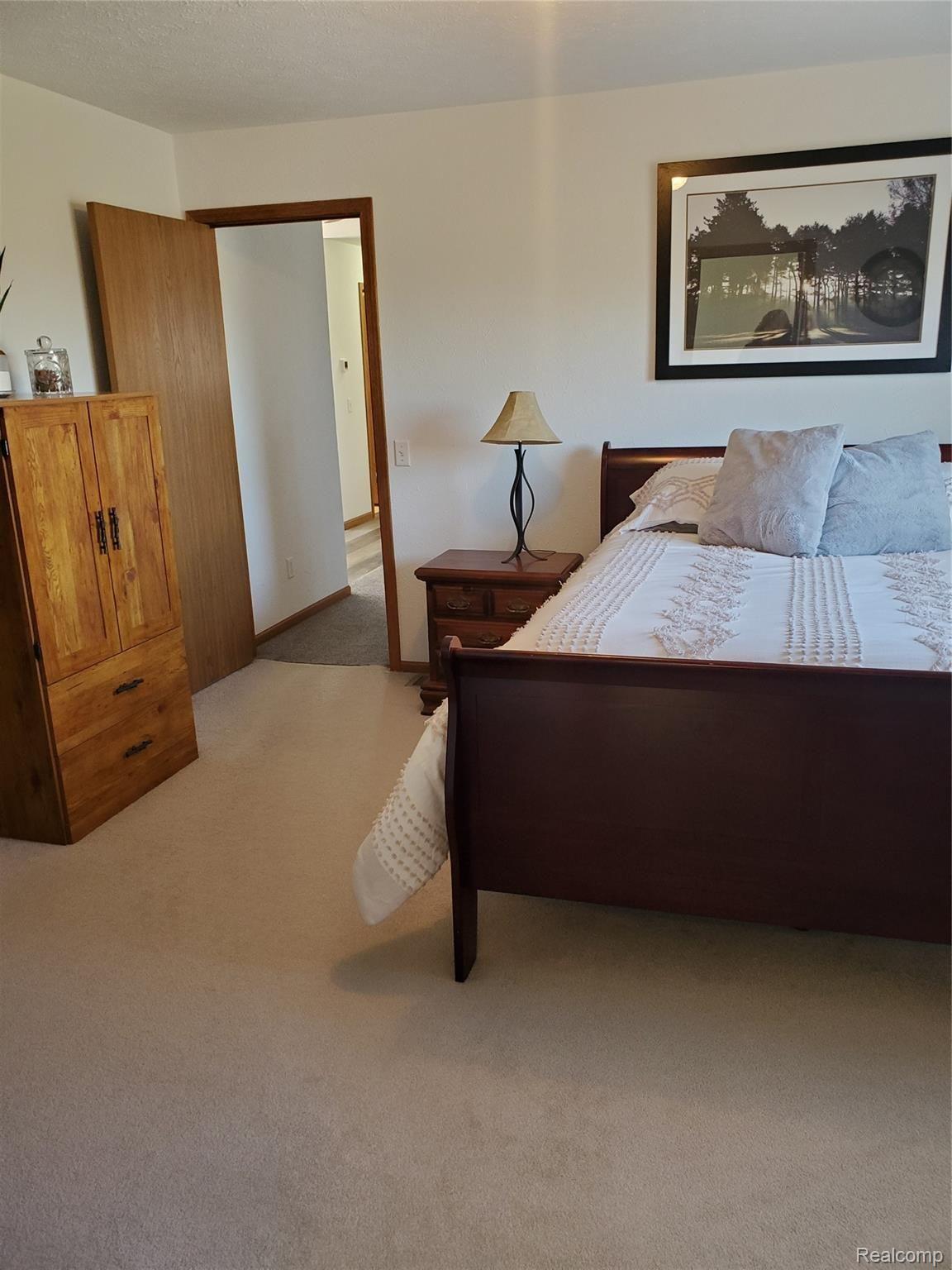 11595 West Sober Road Webberville, MI 48892 - Photo 21 of 42 11595 master bedroom.jpg