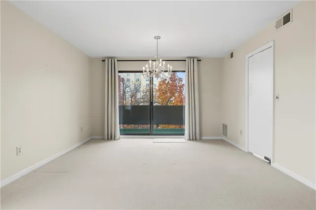 a view of room with window and ceiling fan