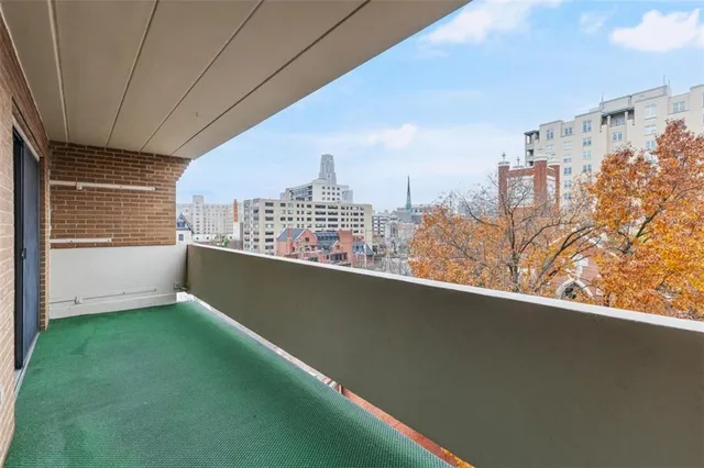 a view of a balcony with city view