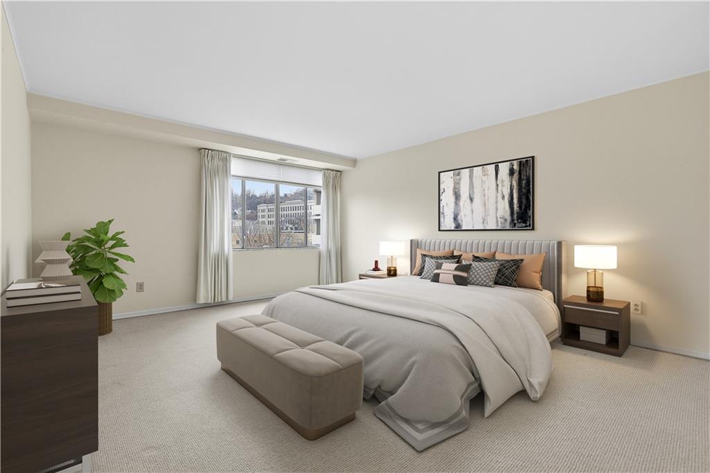 220 North Dithridge Street, Unit 805 Pittsburgh, PA 15213 - Photo 21 of 40 a spacious bedroom with a bed and a window