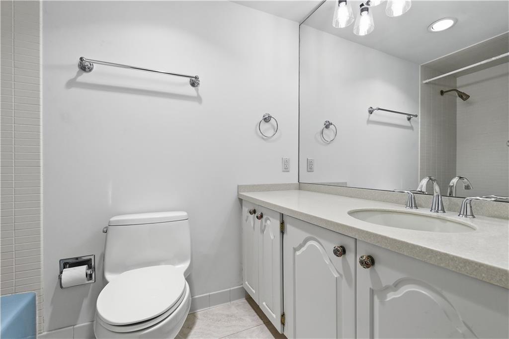 220 North Dithridge Street, Unit 805 Pittsburgh, PA 15213 - Photo 25 of 40 a bathroom with a granite countertop toilet sink and mirror