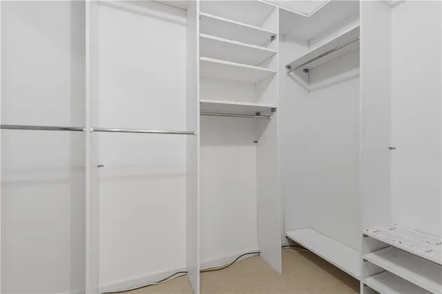 a view of an empty walk in closet