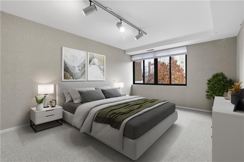 220 North Dithridge Street, Unit 805 Pittsburgh, PA 15213 - Photo 28 of 40 a bedroom with bed and a potted plant