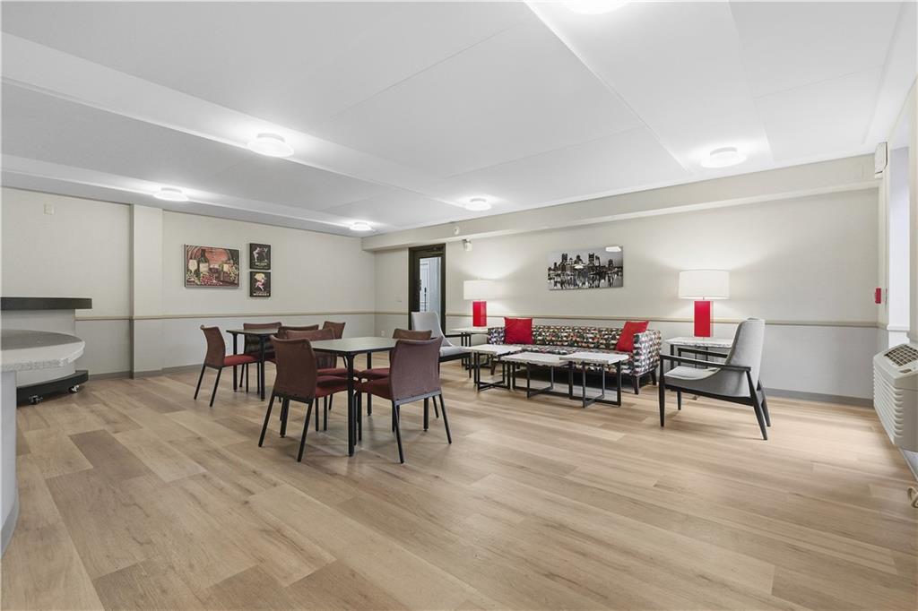 220 North Dithridge Street, Unit 805 Pittsburgh, PA 15213 - Photo 35 of 40 a living room with furniture and a wooden floor