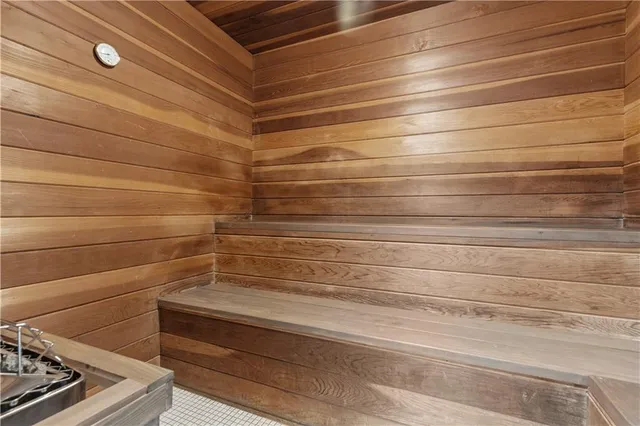 a bathroom with a shower and a sink