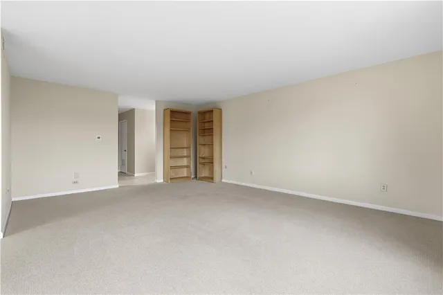 an empty room with a empty space and window