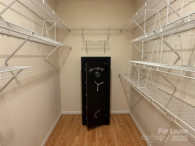 a bathroom with a sink a toilet a mirror and shower