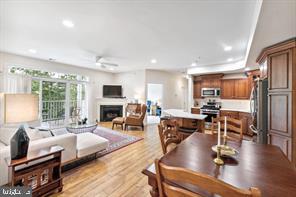 a living room with fireplace furniture and a wooden floor