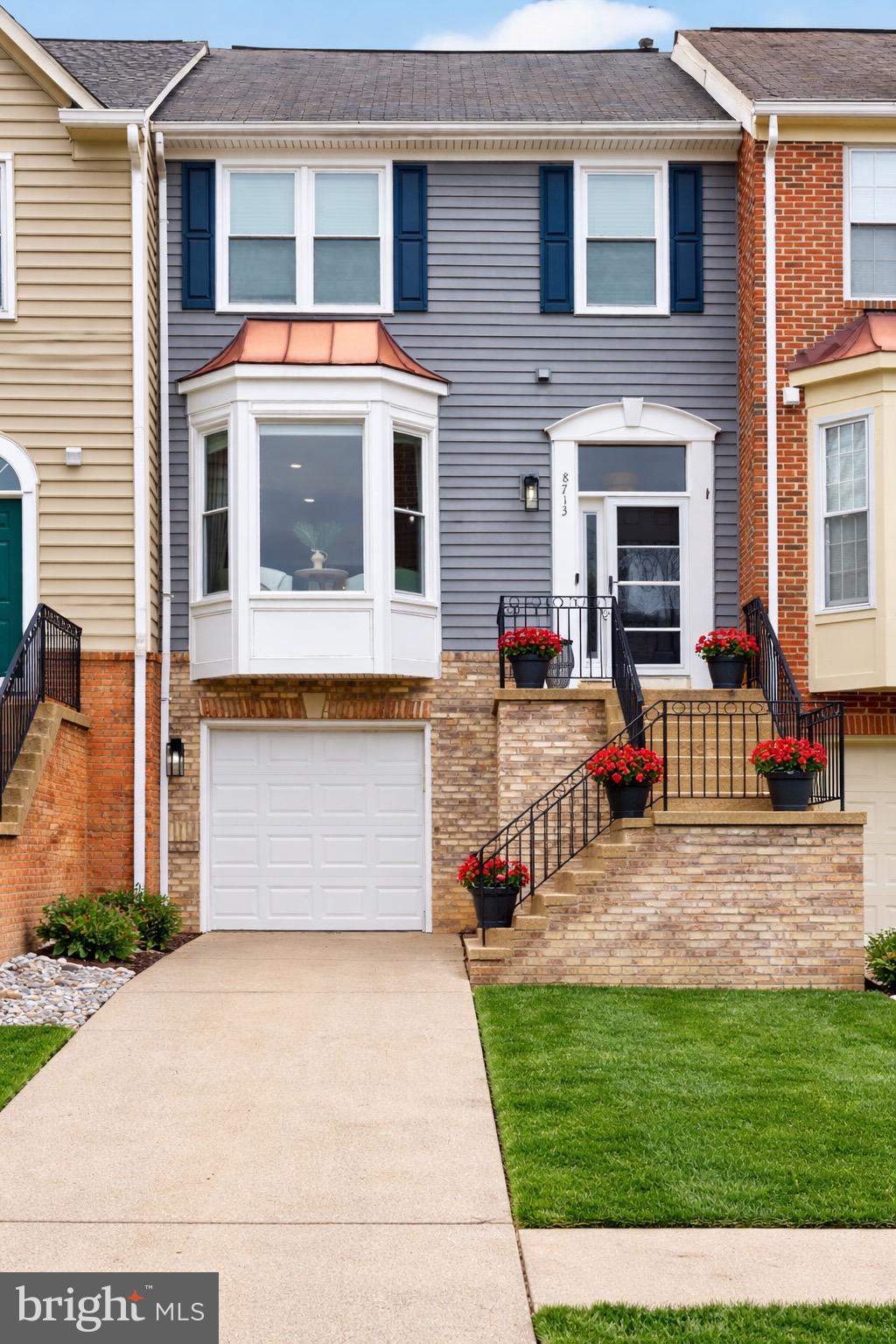 8713 Wadebrook Terrace Springfield, VA 22153 - Photo 1 of 21 a front view of house with yard