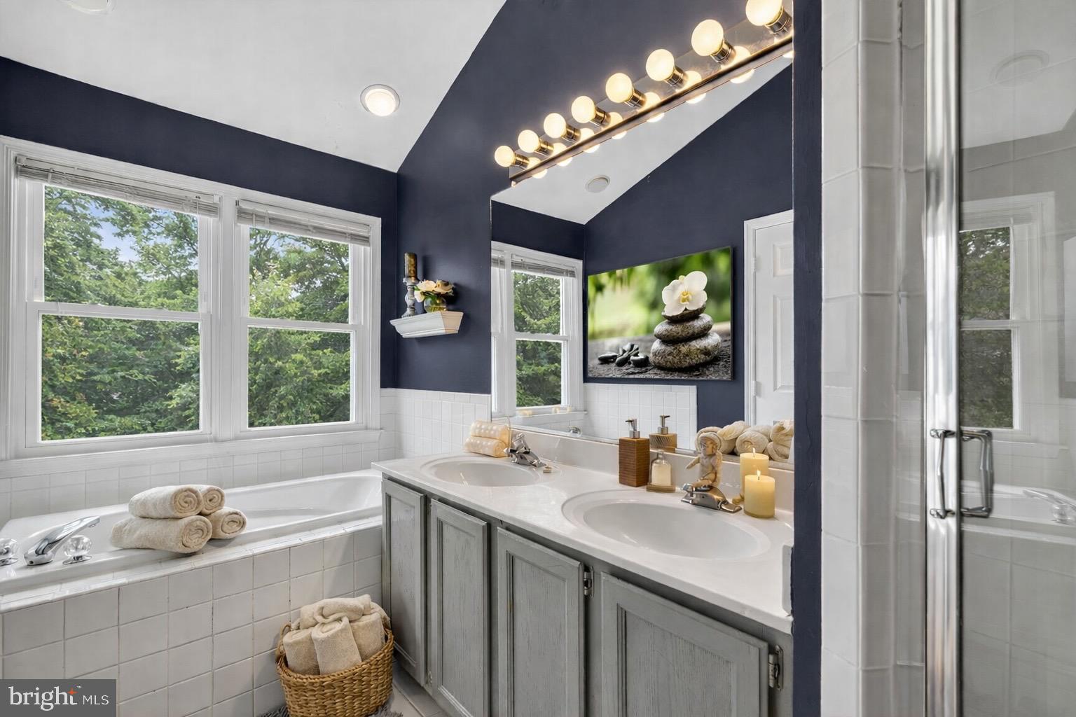 8713 Wadebrook Terrace Springfield, VA 22153 - Photo 11 of 21 a bathroom with a tub sink and large window