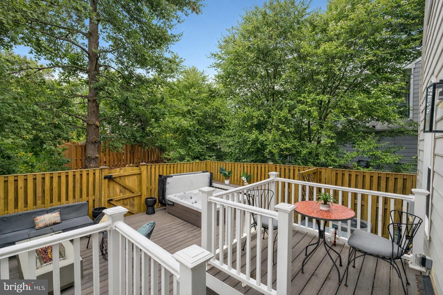 8713 Wadebrook Terrace Springfield, VA 22153 - Photo 17 of 21 a view of a roof deck with chair and wooden floor