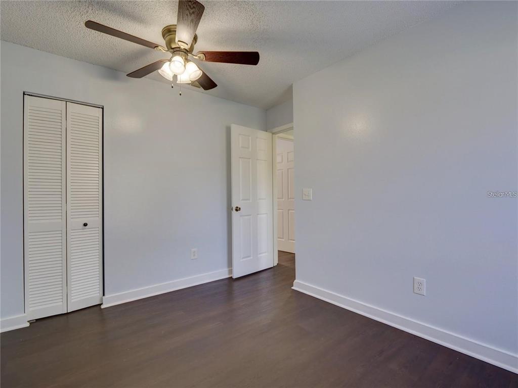351 Monarco Avenue Deltona, FL 32725 - Photo 14 of 19 wooden floor in an empty room