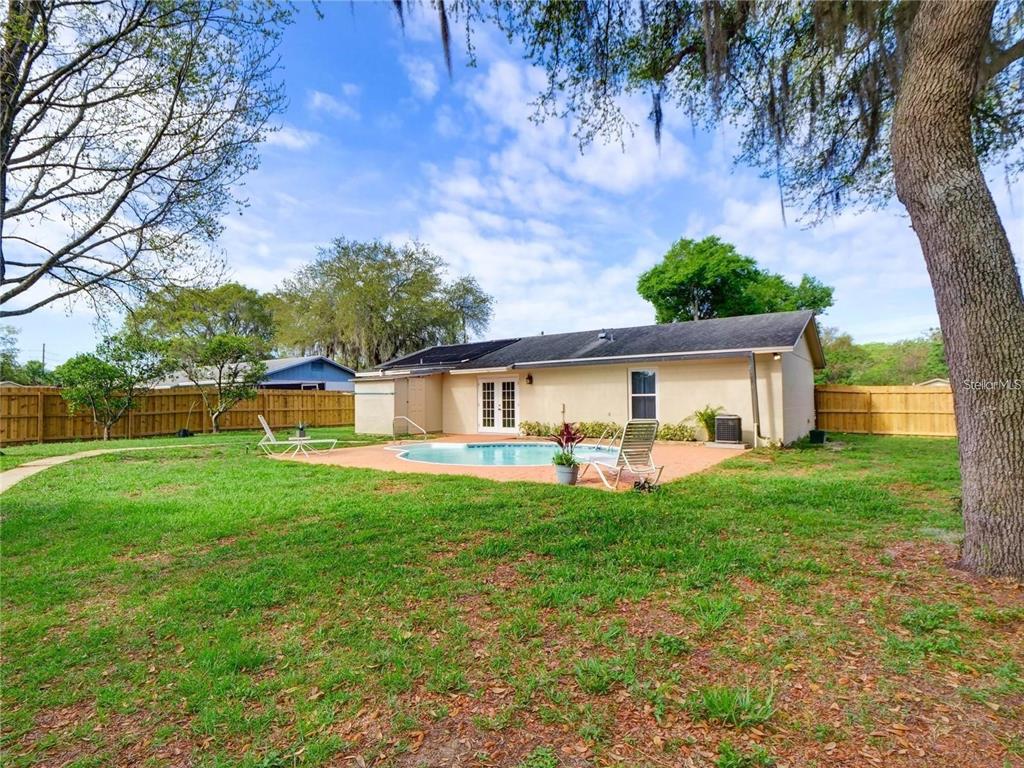 351 Monarco Avenue Deltona, FL 32725 - Photo 18 of 19 a view of a house with a yard and sitting area