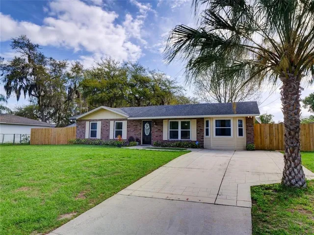 front view of a house with a garden
