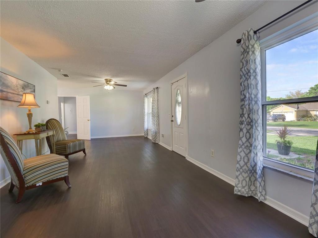 351 Monarco Avenue Deltona, FL 32725 - Photo 4 of 19 a living room with furniture and a window