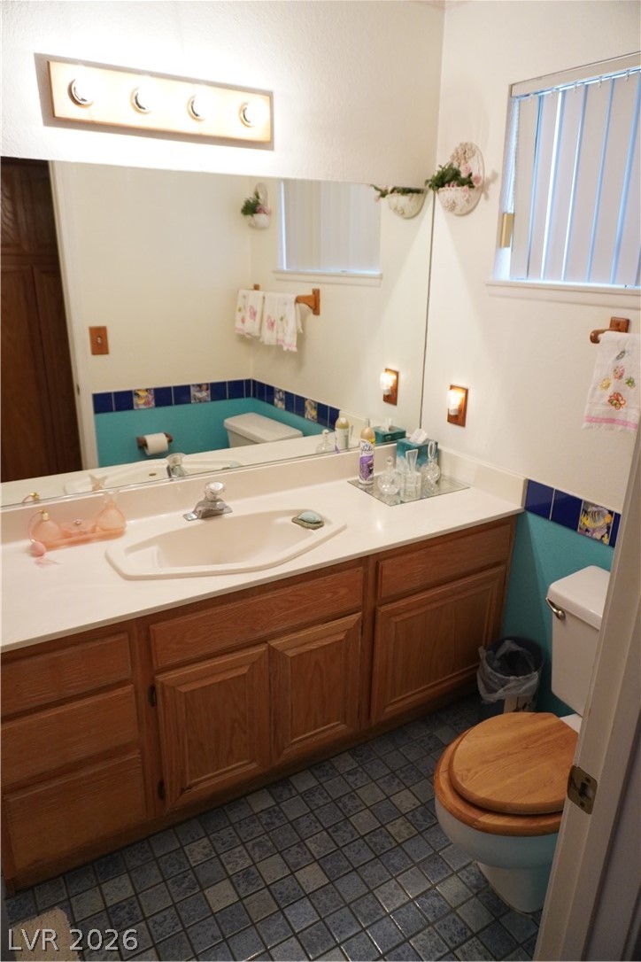 8328 Del Rey Avenue Las Vegas, NV 89117 - Photo 29 of 38 A well-appointed bath features extensive vanity storage, a full mirror, and tiled floors.