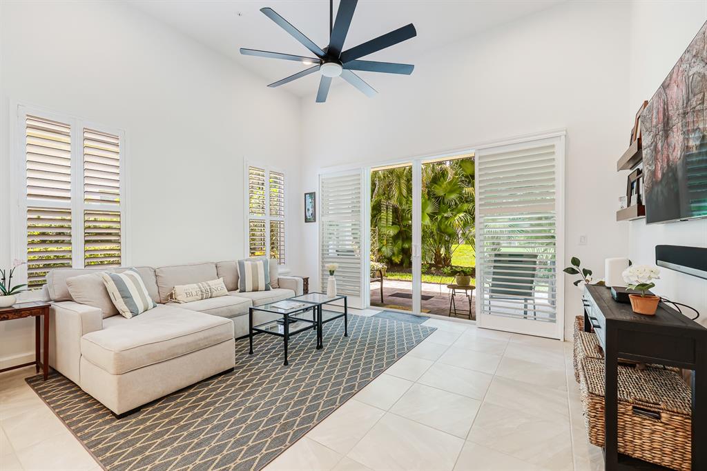 22954 Clear Echo Drive, Unit 31 Boca Raton, FL 33433 - Photo 14 of 44 a living room with furniture and a large window