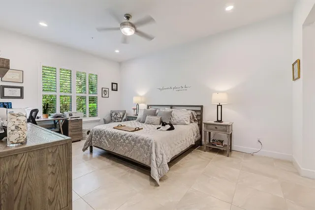 a bedroom with a bed and a dresser in it