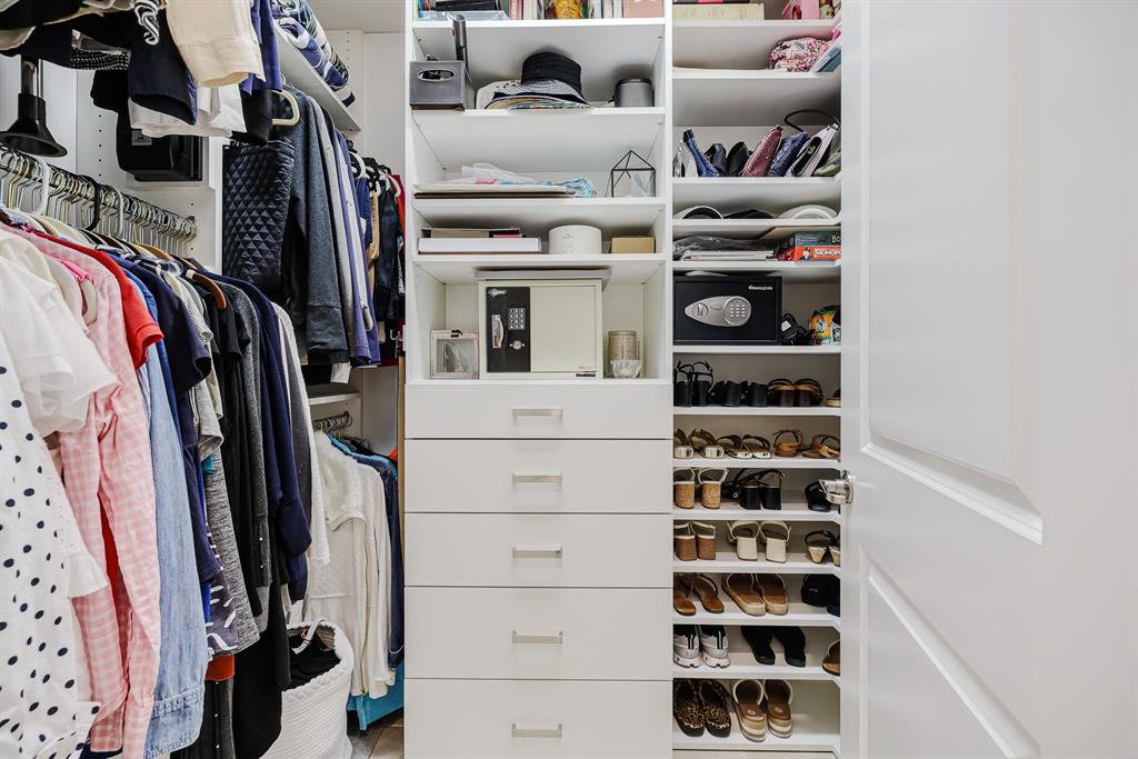 22954 Clear Echo Drive, Unit 31 Boca Raton, FL 33433 - Photo 22 of 44 a view of walk in closet with clothes and shoes