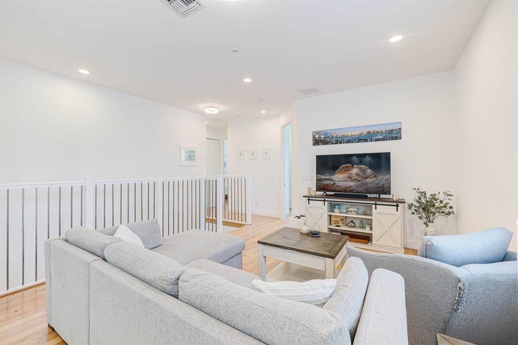 22954 Clear Echo Drive, Unit 31 Boca Raton, FL 33433 - Photo 28 of 44 a living room with furniture and a flat screen tv