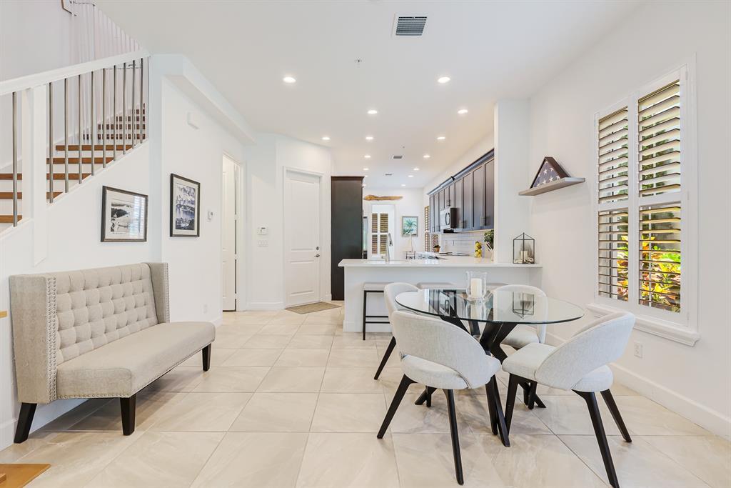 22954 Clear Echo Drive, Unit 31 Boca Raton, FL 33433 - Photo 6 of 44 a view of a dining room with furniture and a large window
