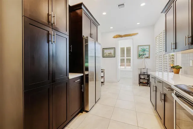 a spacious bathroom with a sink double vanity and a mirror